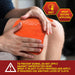 Person applying a hot pack to their knee with safety instructions displayed.